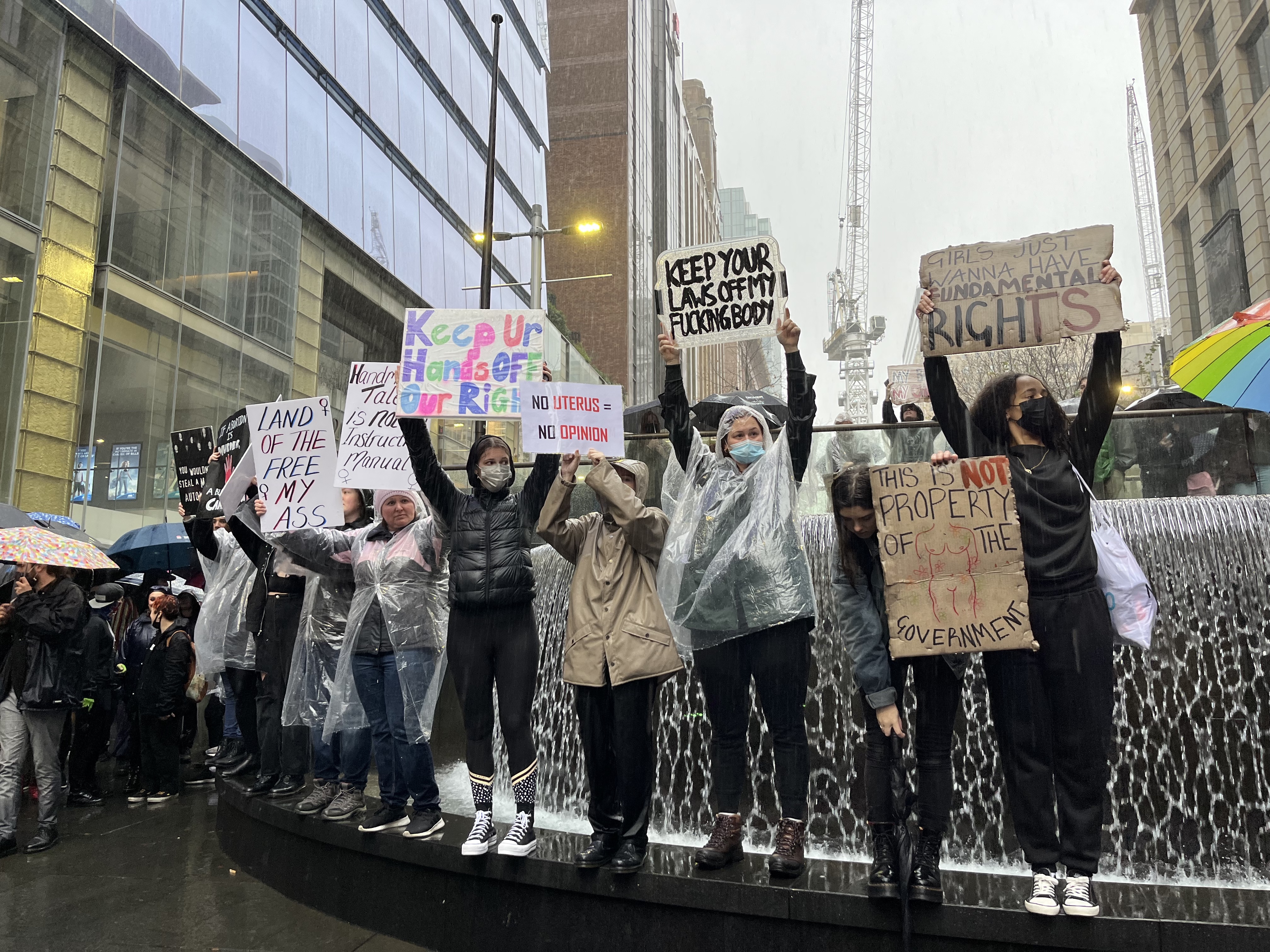 Protesters with their signs at Sydney's Martin Place