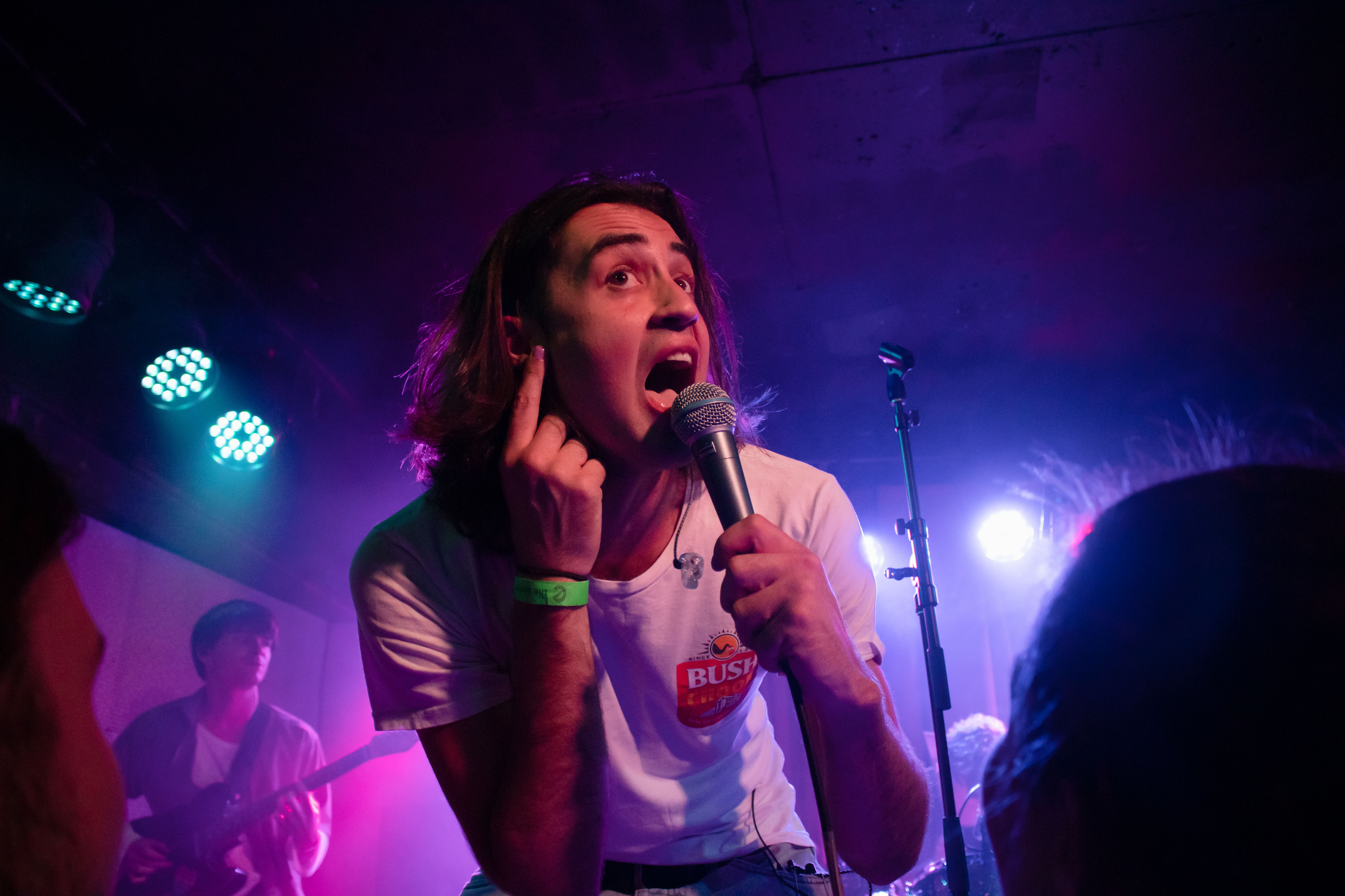 Josh Raven prompts the group to sing along as The Faim performs.