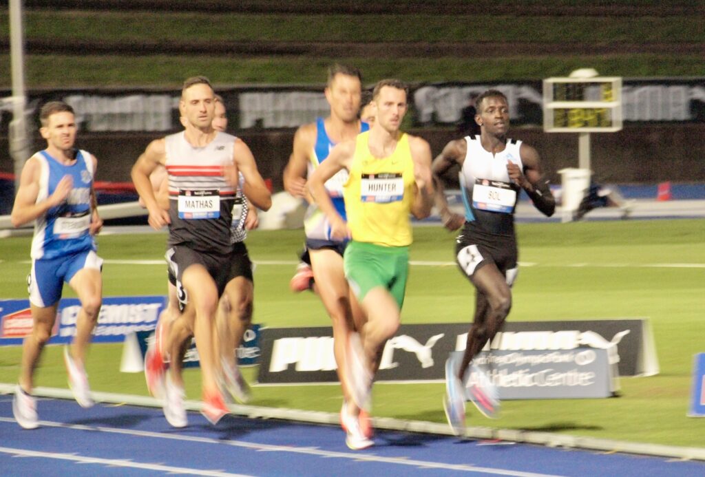 Peter Bol (R) leads the Men's 800m through the first lap at the Australian Athletics Championships. Image: Dan Coppel