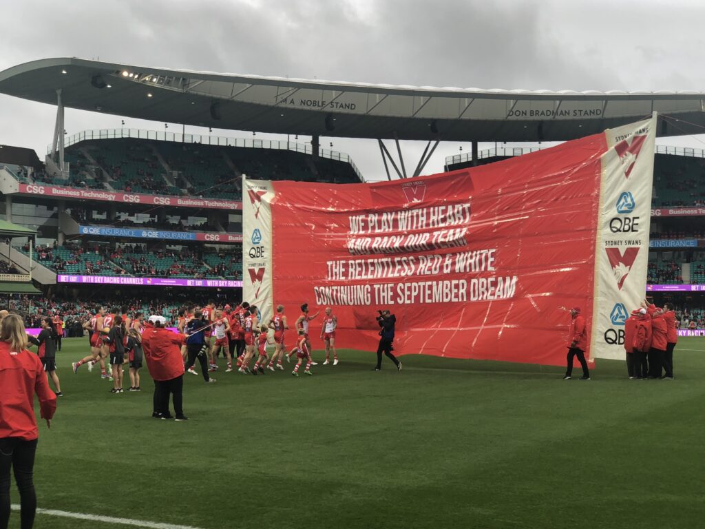 The banner, at full stance, moments before the Sydney Swans run through it during the 2019 AFL season. Image: Dan Coppel