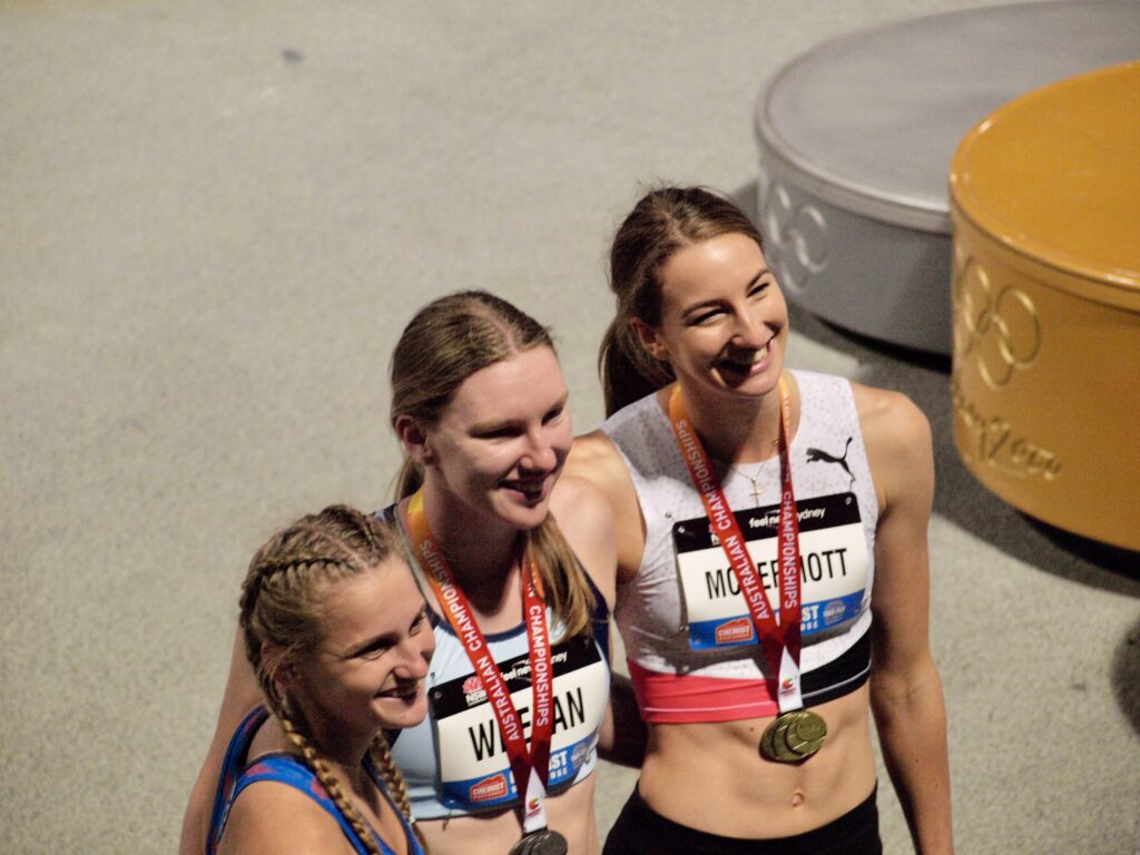 Nicola McDermott celebrates her gold medal from the Australian Athletics Championships. Image: Dan Coppel