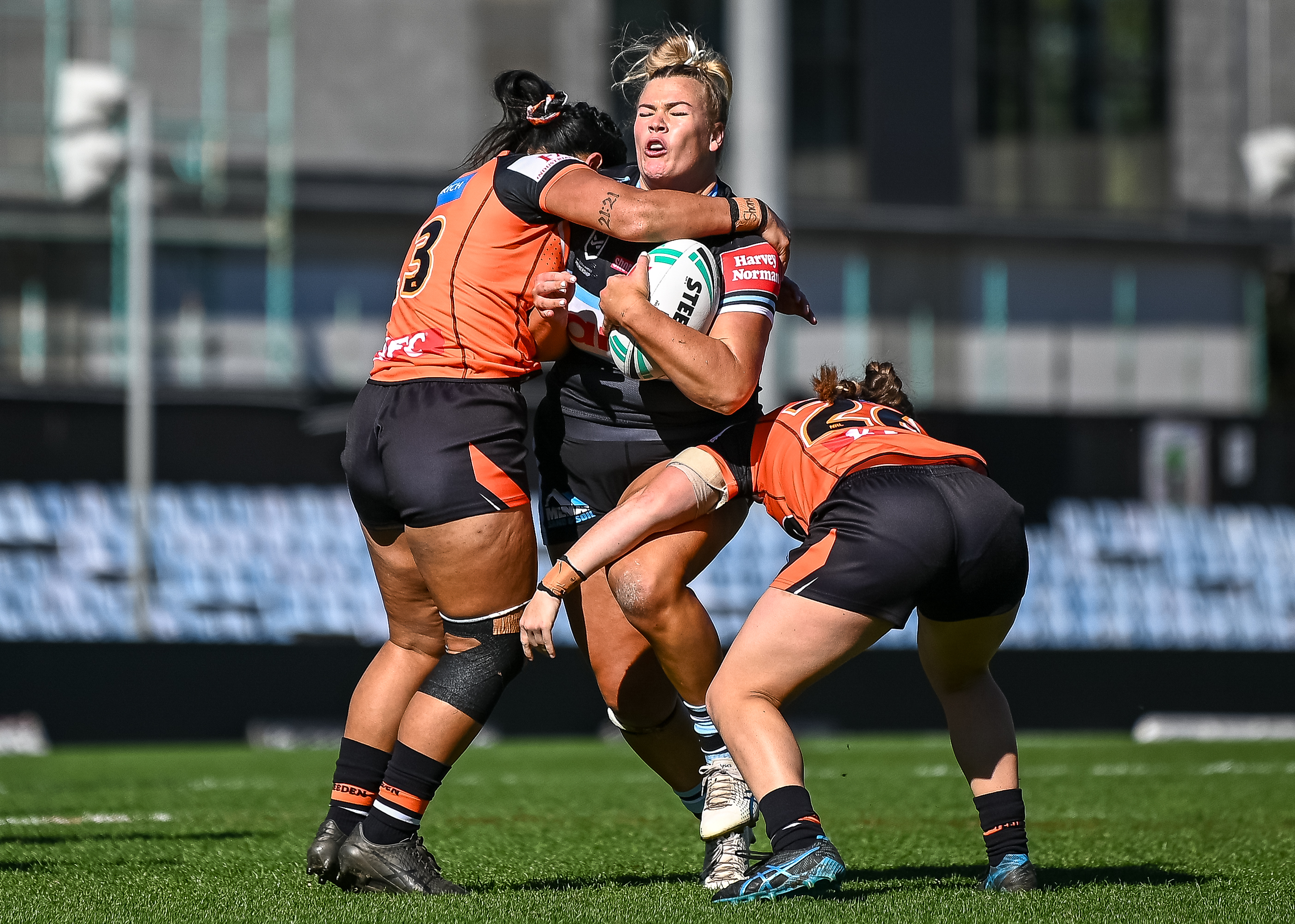 Ellie Johnston carries for the Sharks against the Tigers in a 2023 NRLW preseason trial. Image: Amy Halpin / AH Imagery