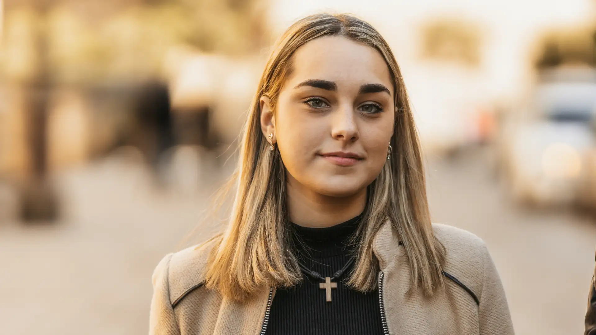 A woman with a cross necklace