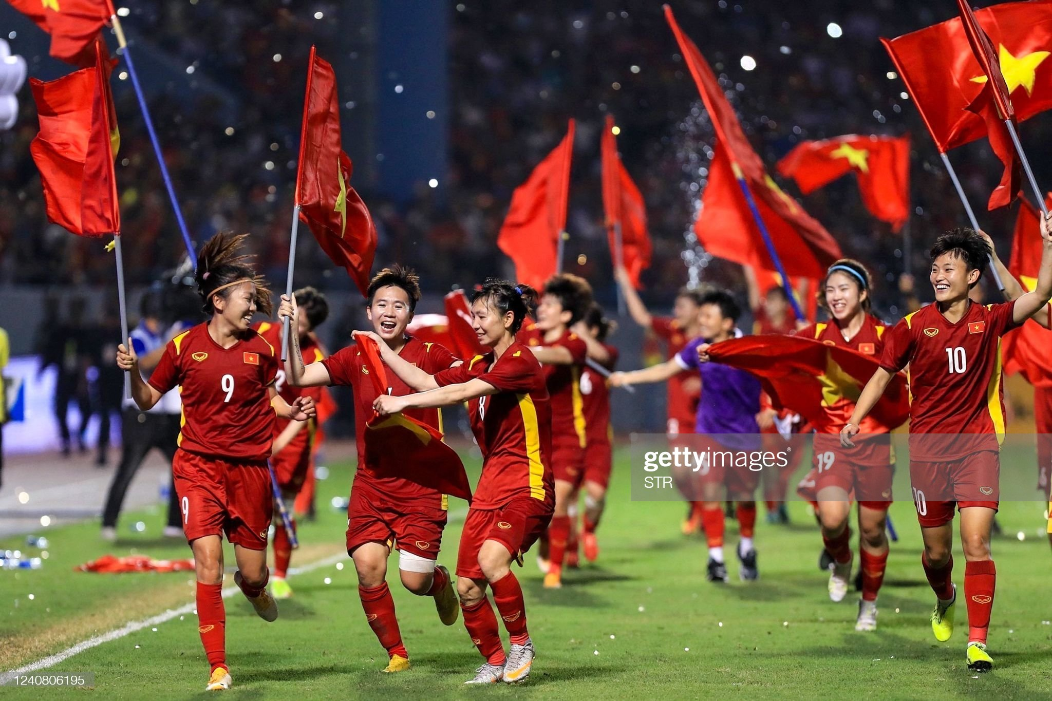 This picture taken and released by the Vietnam News Agency on May 21, 2022 shows Vietnam's players celebrating after beating Thailand in the women's football final match during the 31st Southeast Asian Games (SEA Games) at the Cam Pha stadium in Quang Ninh province. (Photo by Vietnam News Agency / AFP) (Photo by STR/Vietnam News Agency/AFP via Getty Images)