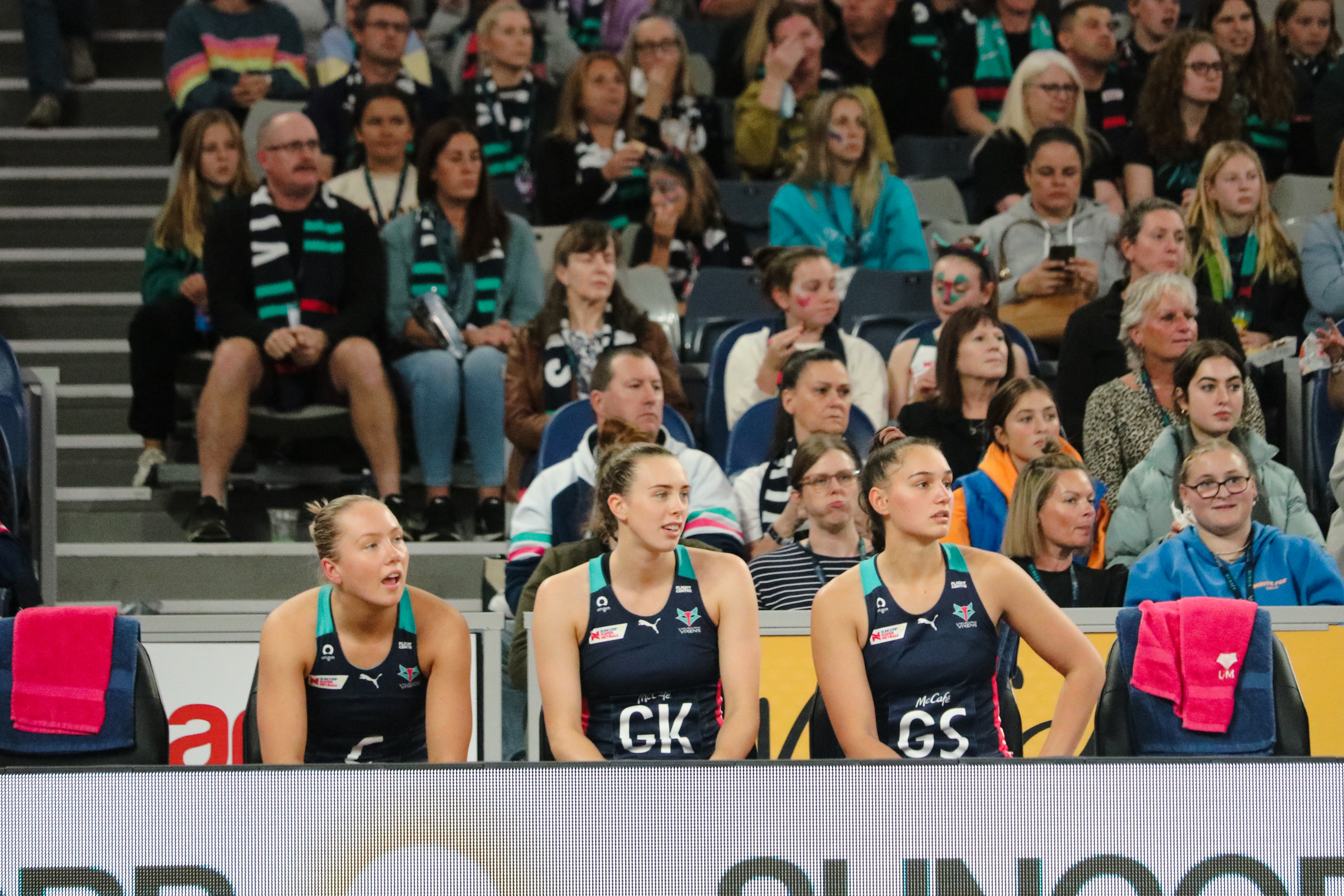 Three of the Vixen's most recent recruits, Hannah Mundy, Liv Lewis and Rahni Samason watch on during the 2022 season. Image: Ariana Silver