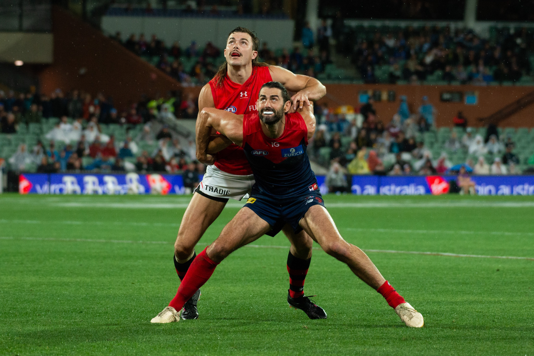 Sam Draper wrestles with Brodie Grundy as part of his matchwinning performance for the Bombers. Image: Dani Brown