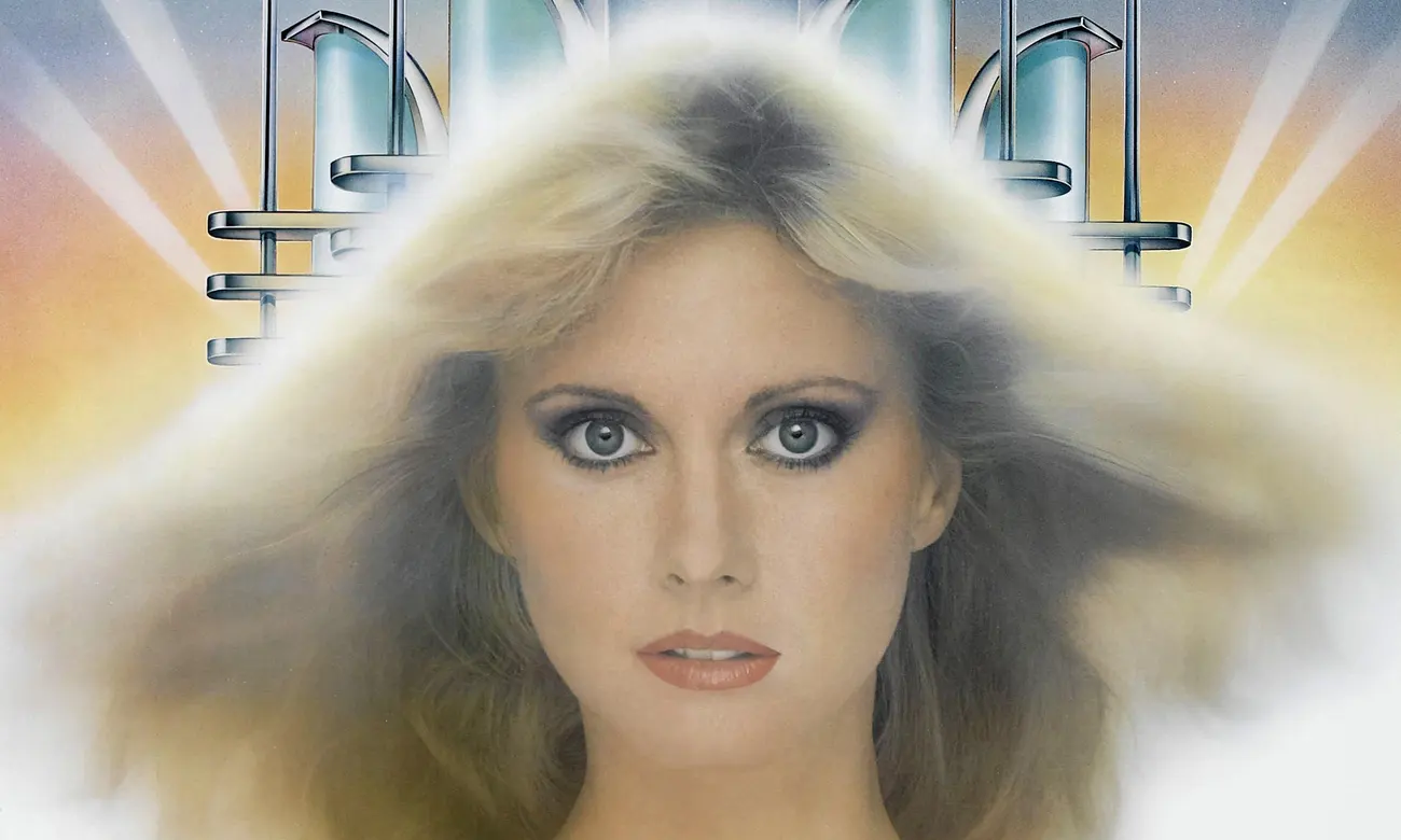 Kira (Olivia Newton-John) the Greek muse.