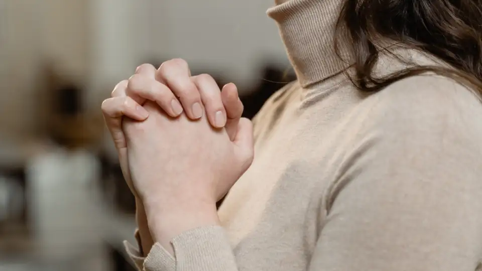 Woman Expressing Her Faith Through Prayer.