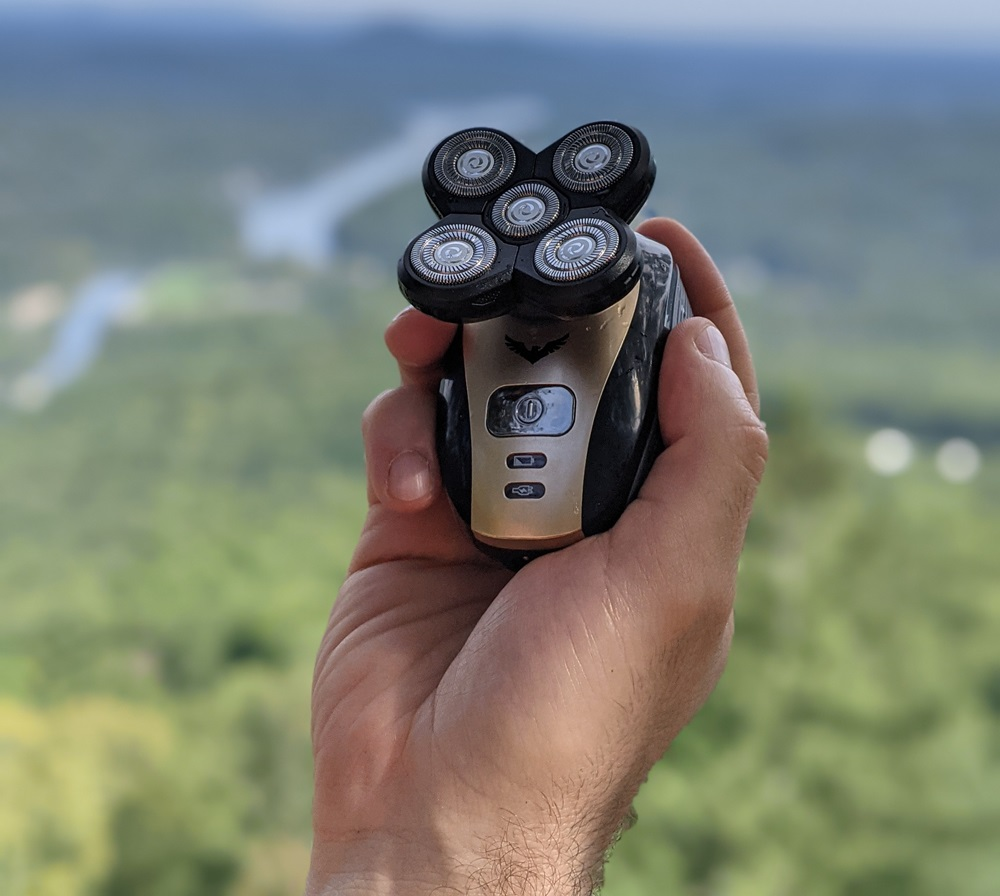 Photo of a Freebird FlexSeries rotary shaver being held in one hand