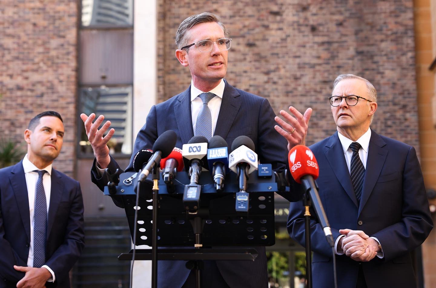 NSW Premier, Dominic Perrottet's (centre) brother has been accused of trying to unseat a Federal MP. Will this hurt the Liberal Party's chance of reelection when the state heads to the polls next month?  (Photo credit: Twitter/Dominic Perrottet)