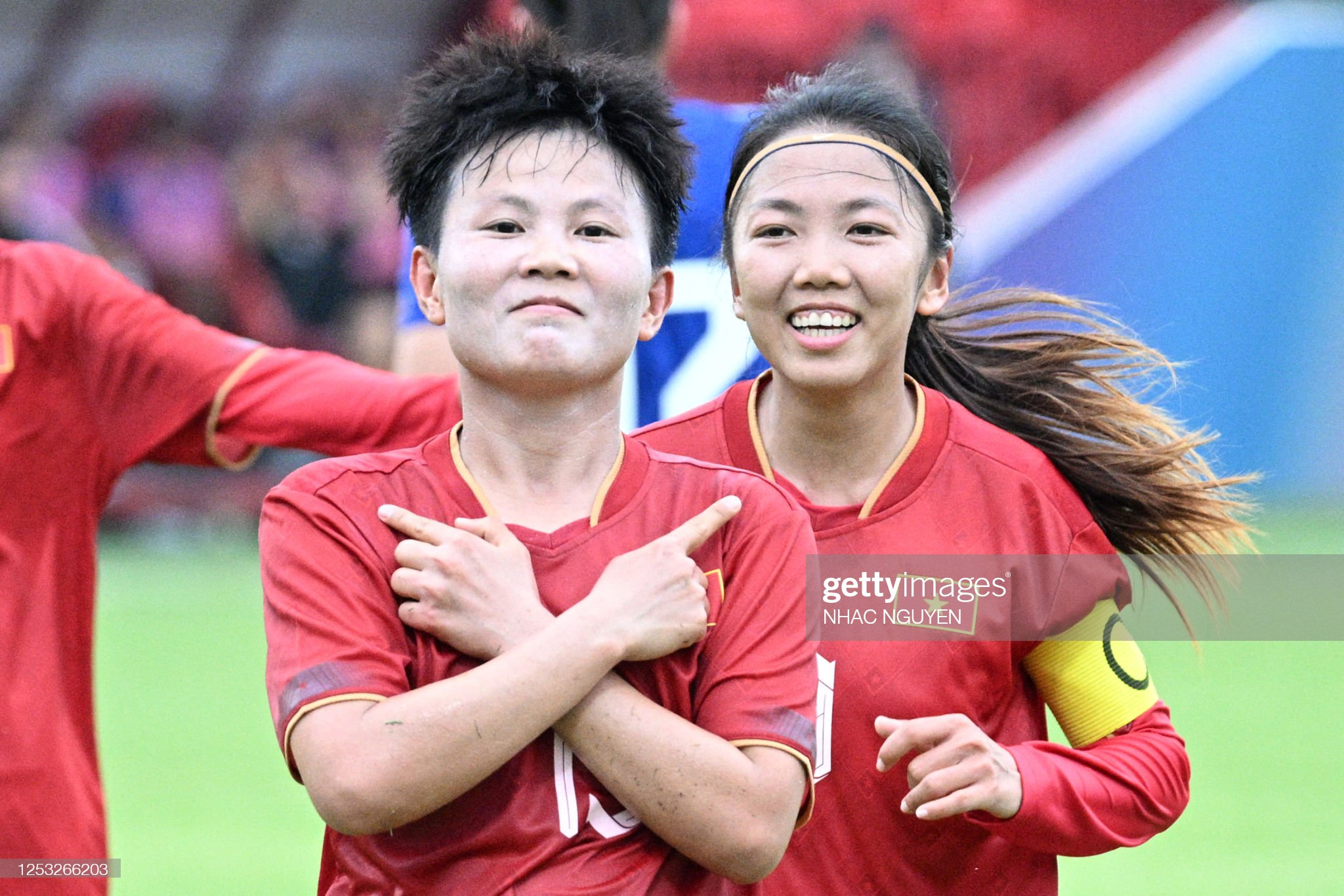 Vietnam's Nguyen Thi Bich Thuy (L) celebrates with Vietnam's captain Huynh Nhu (R) after a goal during the women's football match between Vietnam and Philippines at RSN Stadium during the 32nd Southeast Asian Games (SEA Games) in Phnom Penh on May 9, 2023. (Photo by NHAC NGUYEN / AFP) (Photo by NHAC NGUYEN/AFP via Getty Images)