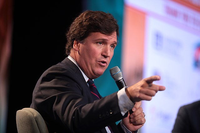 Tucker Carlson's text messages to colleagues suggest he knowingly lied to his audience. (Photo by Gage Skidmore)