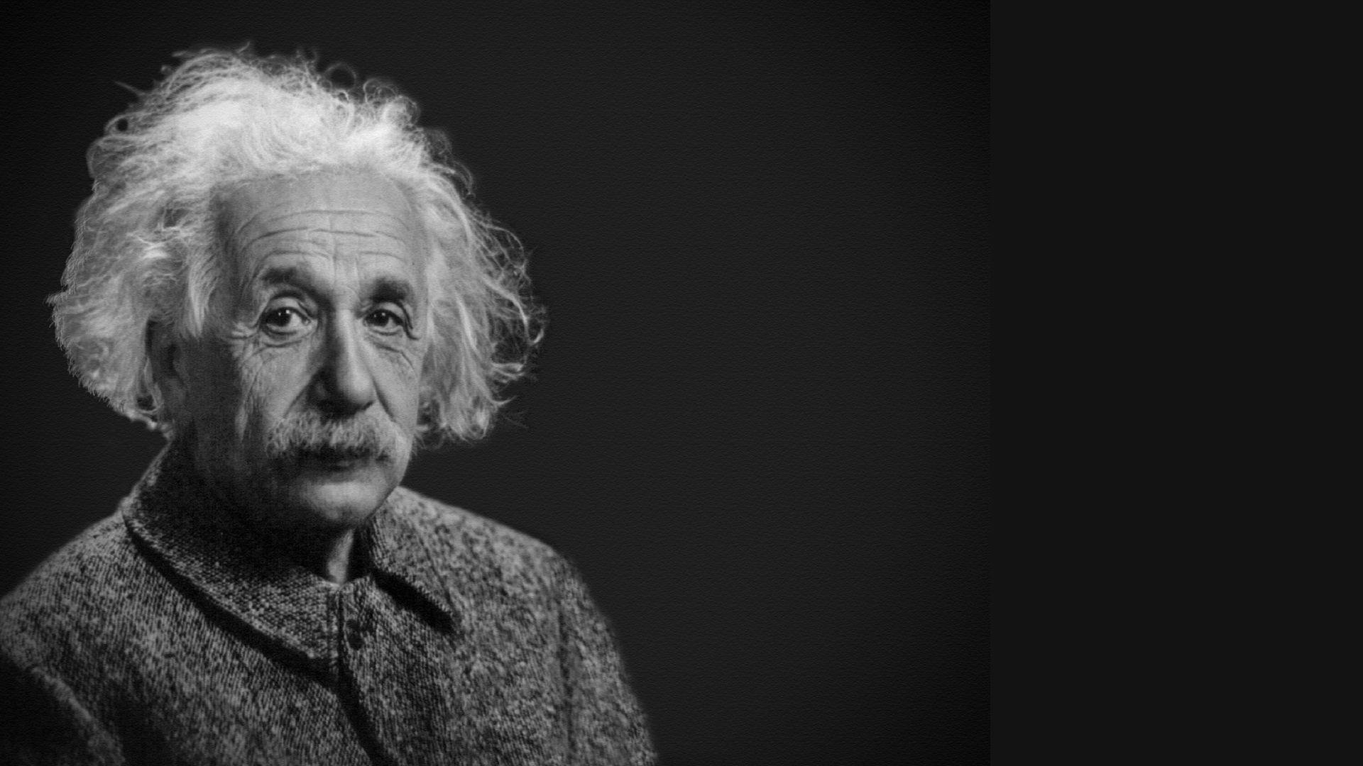 Albert Einstein on dark background, photo in black and white