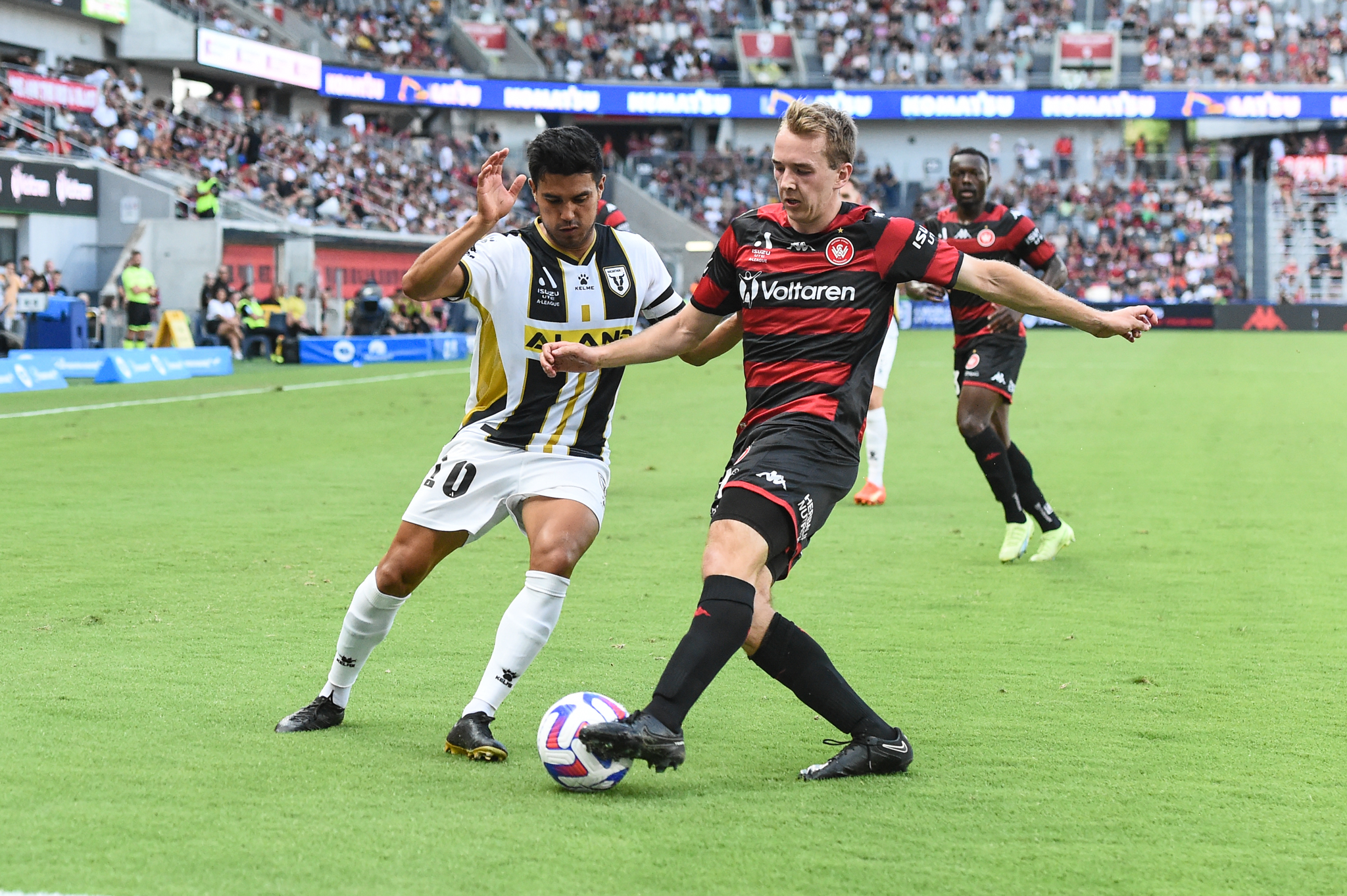 Daniel Wilmering challenges Plascencia for the ball.