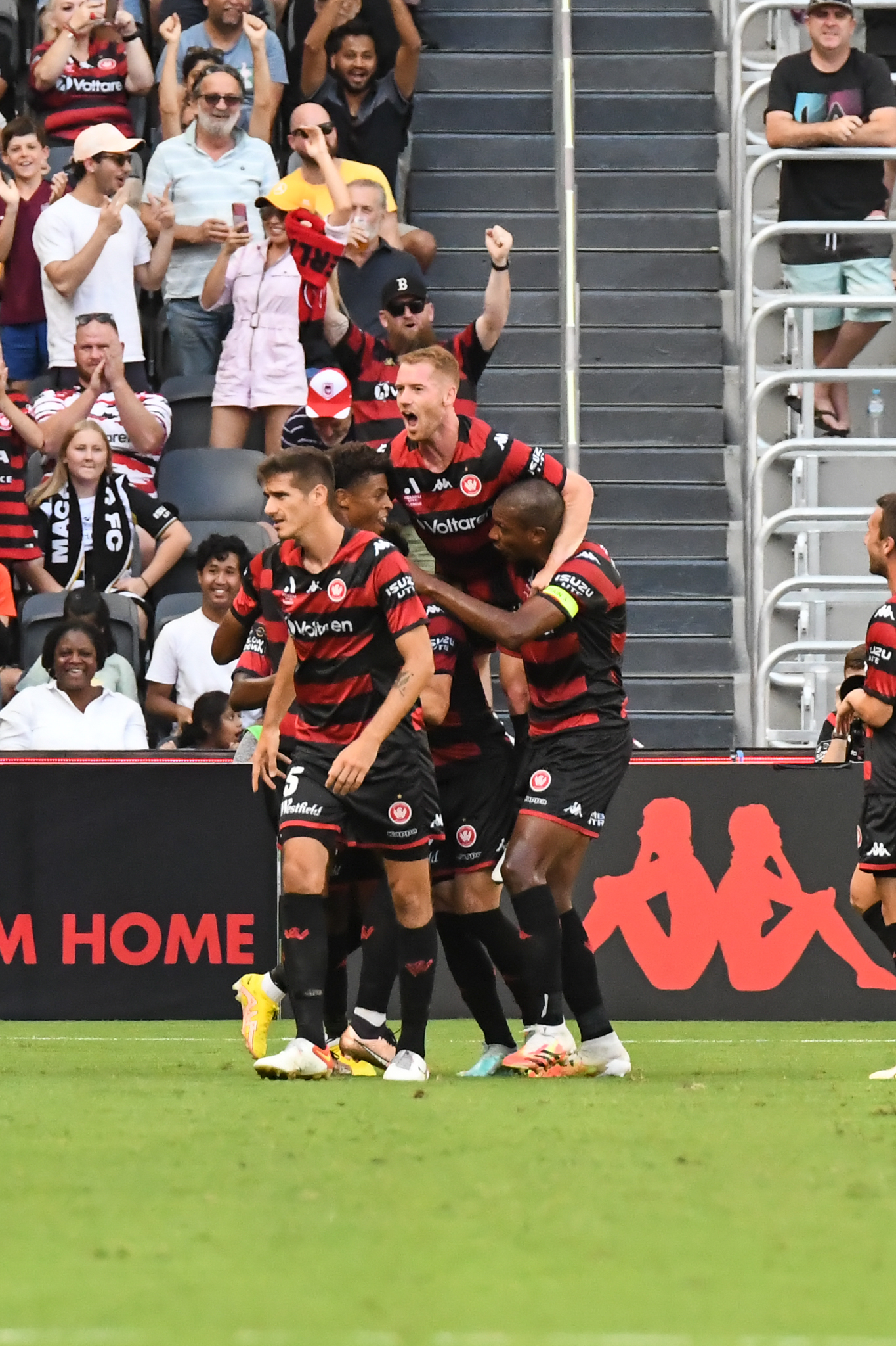 Wanderers players celebrate a goal in the thumping win.