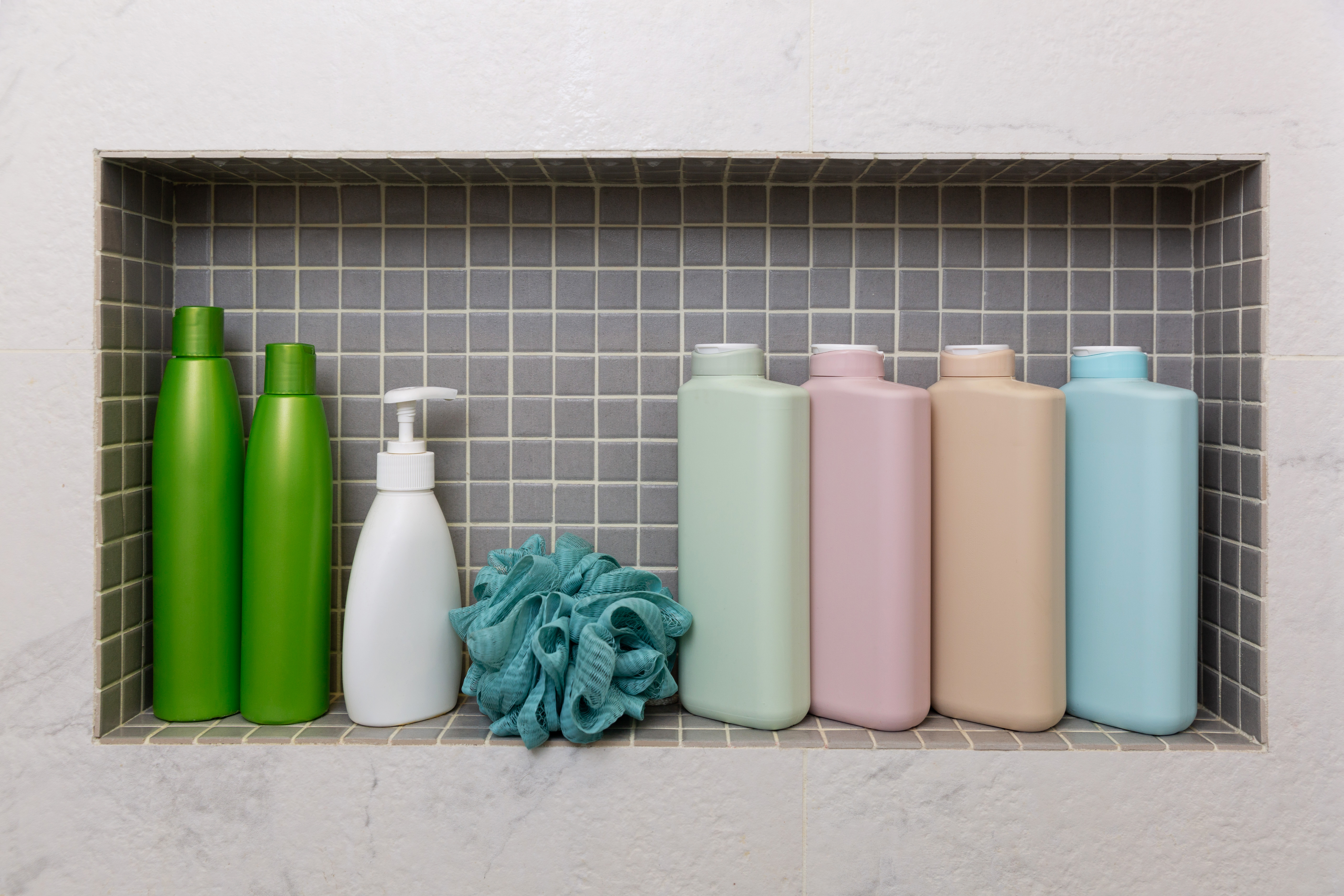 photo of brandless shampoo and hair care products in a bathroom shelf