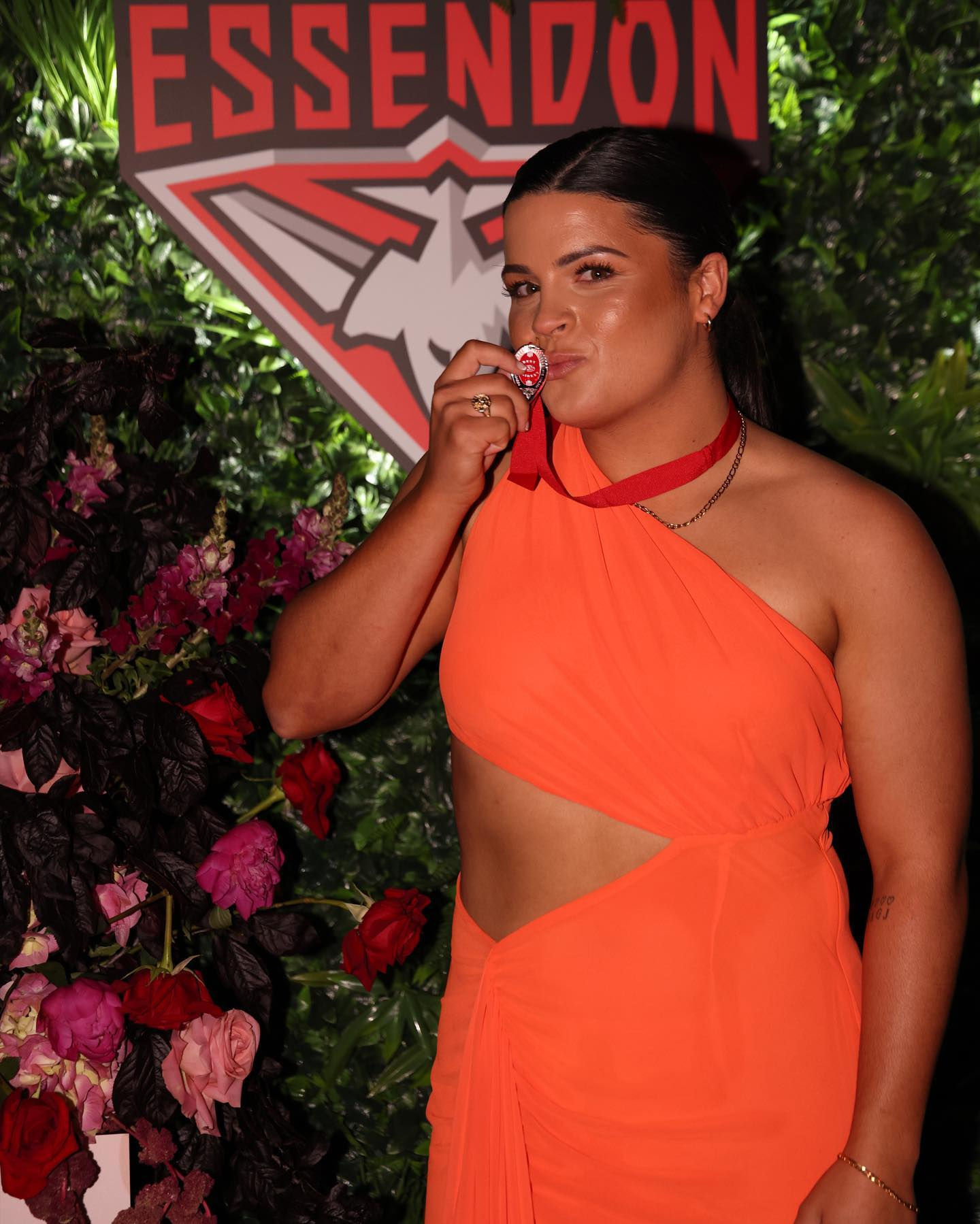 Maddy Prespakis shows off her Best and Fairest medal at Essendon's night of nights. Photo: Essendon Football Club/Facebook.