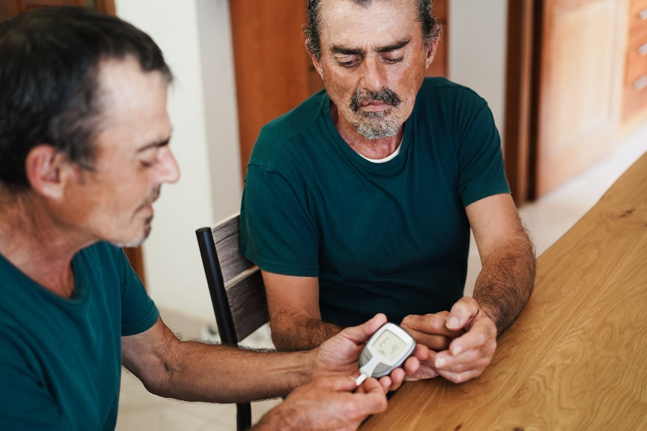 Older man testing his blood sugar