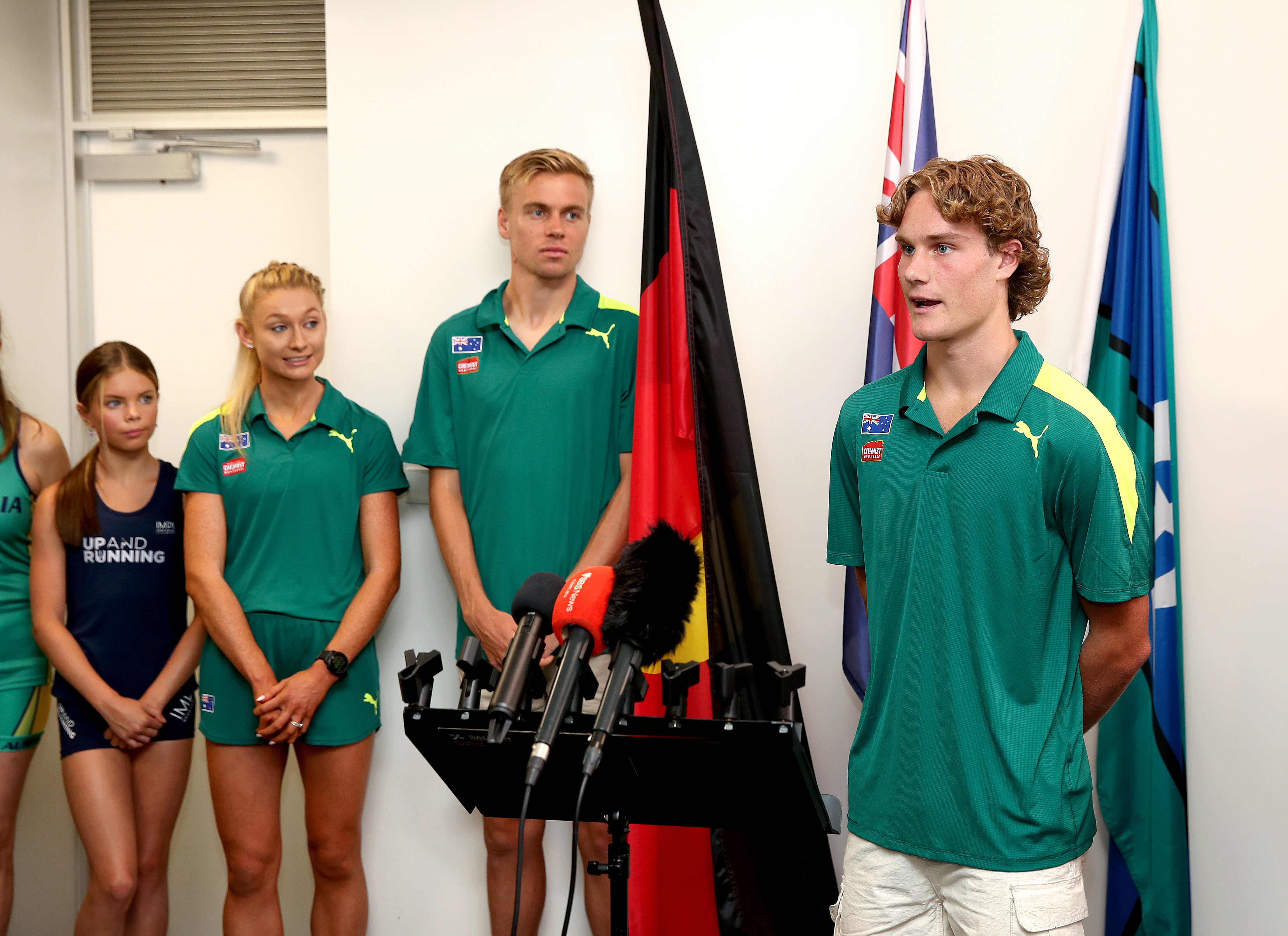 Bailey Habler (right) at the Athletics Australia announcement, as Stewart McSweyn (centre) and Jessica Hull look on. Image: Athletics Australia / Supplied.